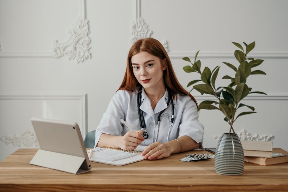 A smiling and relaxed person working at a clean, organized desk.
